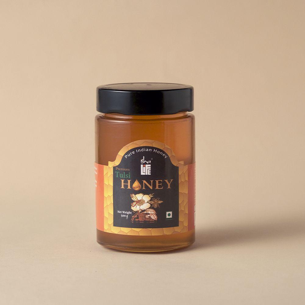Picture of Isha Life Tulsi Honey (500gm). Processed and filtered. Honey mixed with Tulsi extracts. High in medicinal value. Suggested for cold related symptoms.  Good for Immunity