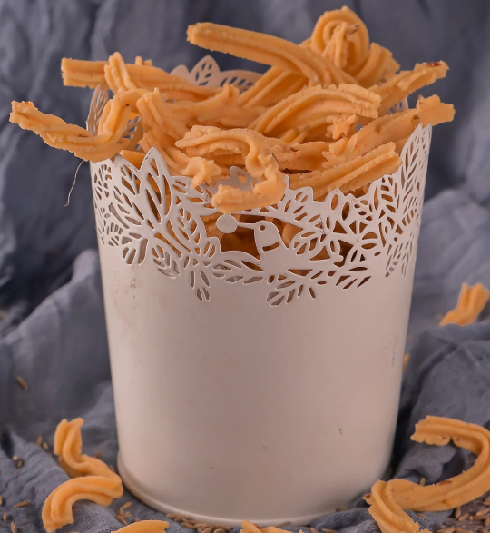 Show details for Vellanki Foods Murukulu - 1 KG Picture of Vellanki Foods Murukulu - 1 KG